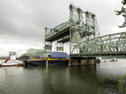 A section of a huge drilling rig goes under the Interstate 5 Bridge in July 2009 on its way to Alaska's North Slope.