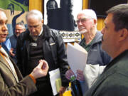 Clark County Commissioner David Madore (left) talked with Jim Ashley (right) after the Washougal City Council Town Hall Saturday morning. Discussions regarding the proposed Columbia River Crossing (I-5 replacement bridge) attracted more than 40 people to City Hall.