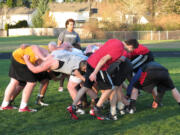 Jason Vailea walks his teammates through the rucking formation Thursday, at Skyridge.