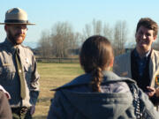 Brett Oppegaard, of Camas (right), gives a demonstration of the Fort Vancouver mobile app to a Washington State University Vancouver class. Chief Ranger Greg Shine is pictured on the left.