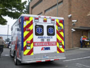 An AMR ambulance crew arrives to a call at the Clark County Jail in October.