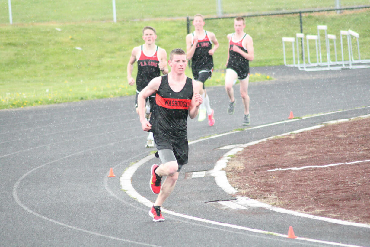 Sean Eustis breaks away for the victory in the mile run for Washougal April 16, at Fishback Stadium.