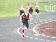 Sean Eustis breaks away for the victory in the mile run for Washougal April 16, at Fishback Stadium.