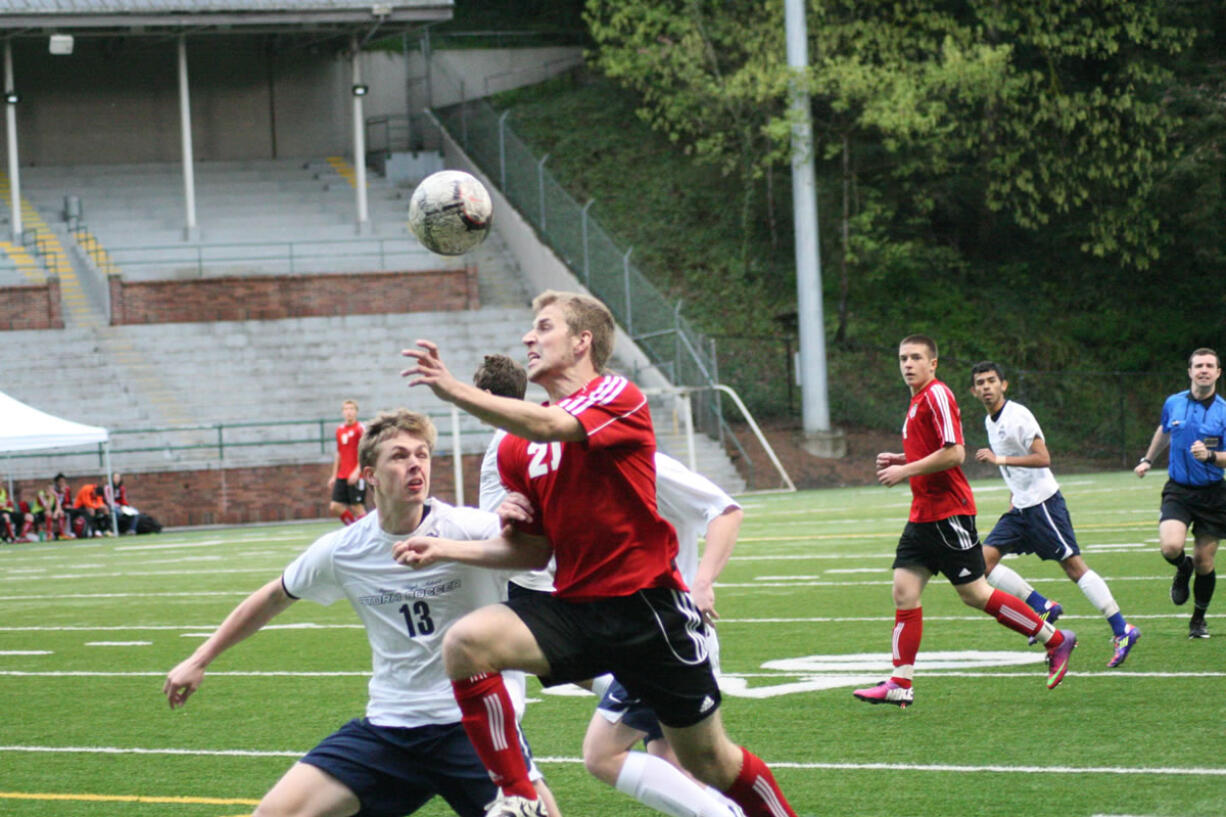 Nate Beasley heads the soccer ball forward for Camas Friday, at Kiggins Bowl.