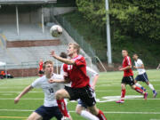 Nate Beasley heads the soccer ball forward for Camas Friday, at Kiggins Bowl.