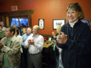 Shonny Bria, right, former superintendent of Battle Ground Public Schools, reacts to the news that the district passed its four-year maintenance and operations levy on April 23. District residents have sharply criticized the school board for its secrecy surrounding the buyout of the contract for Bria, who retired June 30.