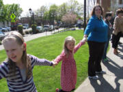 Patrons of all ages gathered April 17, to &quot;hug&quot; the Camas Public Library, in celebration of its 90th birthday.