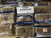 Mexican tar heroin seized in drug raid operations is seen in California.