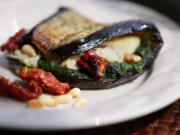 Fried eggplant slices can be made malleable and used to make a wrap with a stuffing of cheese, pine nuts, spinach and sun-dried tomatoes.