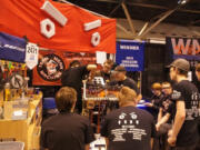 Students on the Camas-Washougal Robotics Team, known as &quot;Team Mean Machine,&quot; make adjustments to their robot, Odd Job, during a competition.