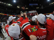 The Portland Winterhawks hoist the Ed Chynoweth Trophy as champions of the Western Hockey League after defeating the Edmonton Oil Kings 5-1 in Game 6 on Sunday in Edmonton.