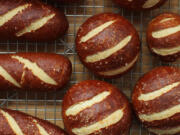 While the innards of a sandwich get the most attention, stacking them inside a strikingly contrasted pretzel bun doubles the pleasure.