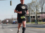 Photo by Phillip Yeary
Dr. Darren Smith, of Camas, ran in the Greensboro BB&amp;T Gate City 8K, in North Carolina, in April. It was the inaugural event for &quot;TeamUP,&quot; which consists of eight people who have paralysis in one or both of their legs as a result of foot drop. The members have overcome their mobility issues with orthotic devices made by Allard USA. Smith, 47, plans to participate in the Rock 'n' Roll Portland Half Marathon Sunday.