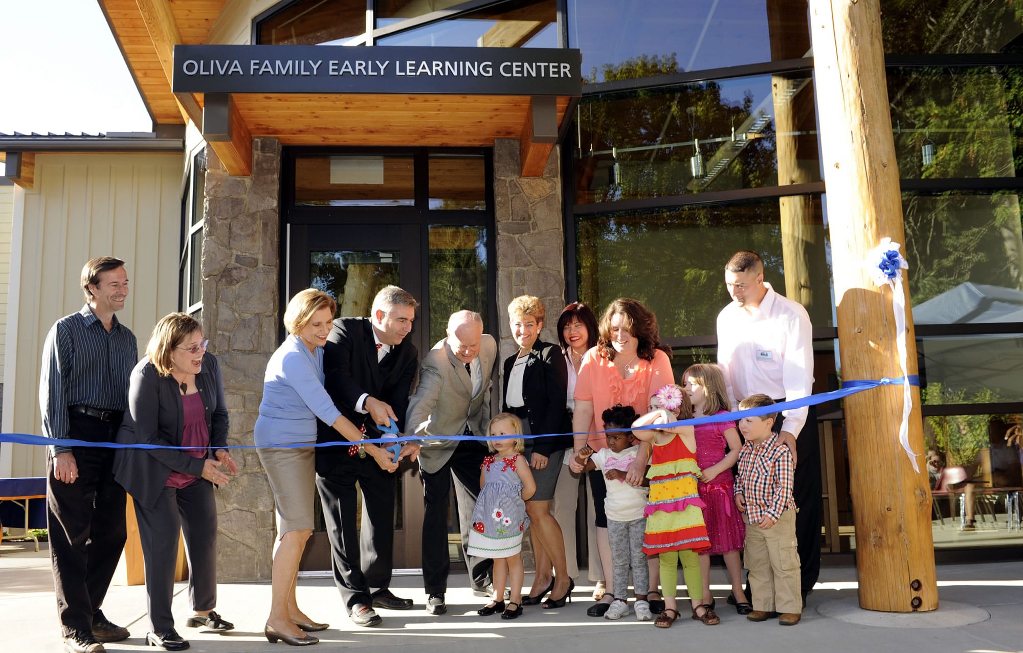 Jan Oliva, third from left, cuts a ribbon with Clark College President Bob Knight and her husband, Steve, as others watch during the official opening of the Oliva Early Learning Center at Clark College in September 2011. At an event Wednesday night, Jan Oliva and Knight announced the college's $20 million fundraising campaign. Already, $17 million has been raised.