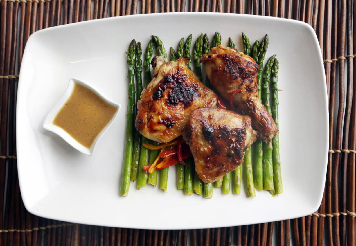 Fresh lemons, olive oil and Dijon mustard are paired with chicken, asparagus and sweet mini bell peppers in this dish.