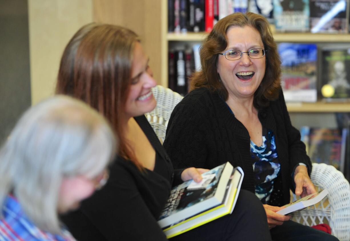 &quot;You pay me to lie to you!&quot; is how novelist Lilith Saintcrow, center, summed up the fiction writer's task -- to the amusement of fellow writers Carolyn J.