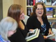 &quot;You pay me to lie to you!&quot; is how novelist Lilith Saintcrow, center, summed up the fiction writer's task -- to the amusement of fellow writers Carolyn J.