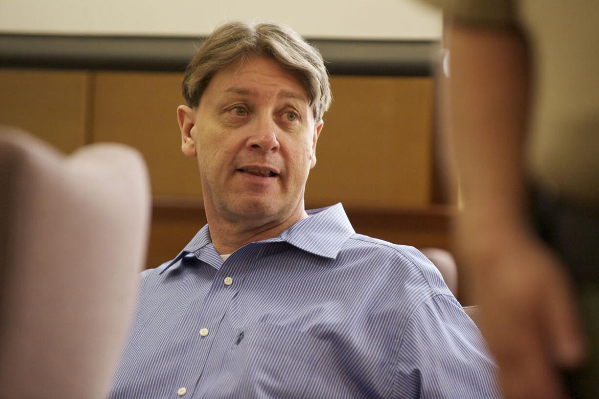 Dennis Wolter, accused of killing his estranged  girlfriend and dumping her body along Old Evergreen Highway, turns during a recess of his trial in Judge Robert Lewis' courtroom, Wednesday, May 29, 2013.