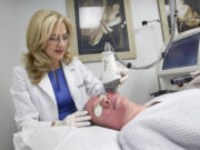 Dr. Leyda E. Bowens performs a Fraxel Laser treatment for wrinkles and acne scars on Maria Elena Ferrer on the Mercy Hospital campus in Miami, Florida,  on April 17, 2013. (C.W.