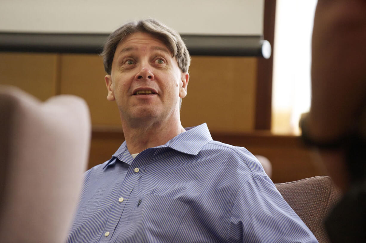 Dennis Wolter, accused of killing his estranged  girlfriend and dumping her body along Old Evergreen Highway, turns during a recess of his trial in Judge Robert Lewis' courtroom, Wednesday, May 29, 2013.