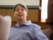 Dennis Wolter, accused of killing his estranged  girlfriend and dumping her body along Old Evergreen Highway, turns during a recess of his trial in Judge Robert Lewis' courtroom, Wednesday, May 29, 2013.