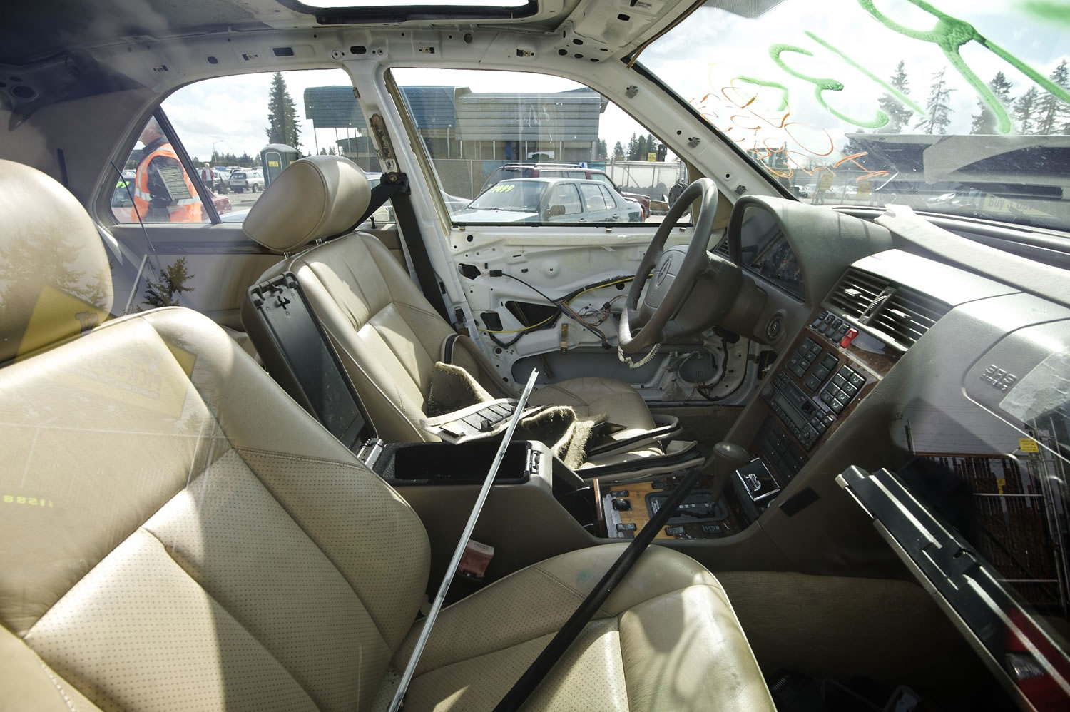 The shell of an abandoned car sits at a local junk yard Friday as it is slowly stripped of it valuable parts.