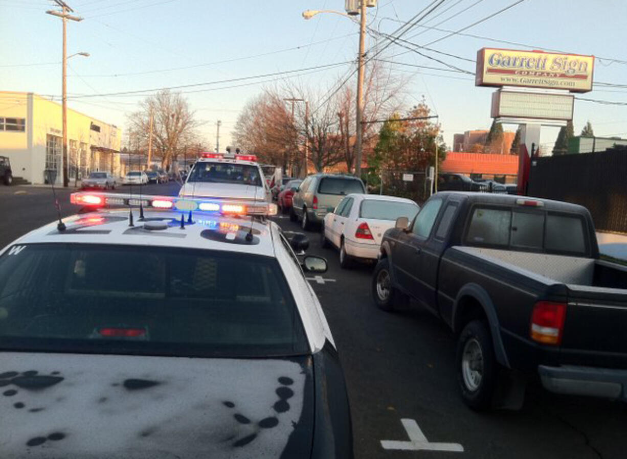 Vancouver Police check out a possible abandoned vehicle on Harney Street in December 2011.