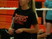 New Washougal High School volleyball coach Mallorie Thompson fires the Panthers up during open gym.