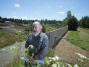 Stephen Wille, chairman of the Countryside Woods Neighborhood Association, stands last week at the boundary between First Place Neighborhood Park and the Evergreen Pit.