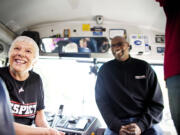 Ryan Prouty/Portland Trail Blazers
Vanora Volk, left, a bus driver for Vancouver Public Schools, gets a visit with former Portland Trail Blazer Jerome Kersey on her bus as she is honored for demonstrating the spirit of Damian Lillard's &quot;Respect, Pass It On&quot; program.