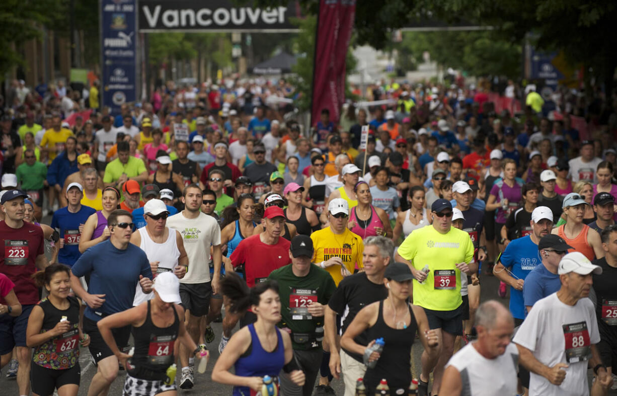 Runners start the 2012 Vancouver USA Marathon, Sunday, June 17, 2012.