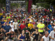 Runners start the 2012 Vancouver USA Marathon, Sunday, June 17, 2012.