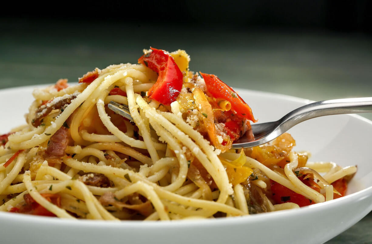 There are many creative ways to serve the seasonal bounty of vegetables through such dishes as spaghetti with wilted peppers.