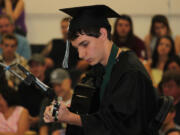 Hayes Freedom graduating senior Nicholas Bacon performs during the commencement ceremony on Saturday.