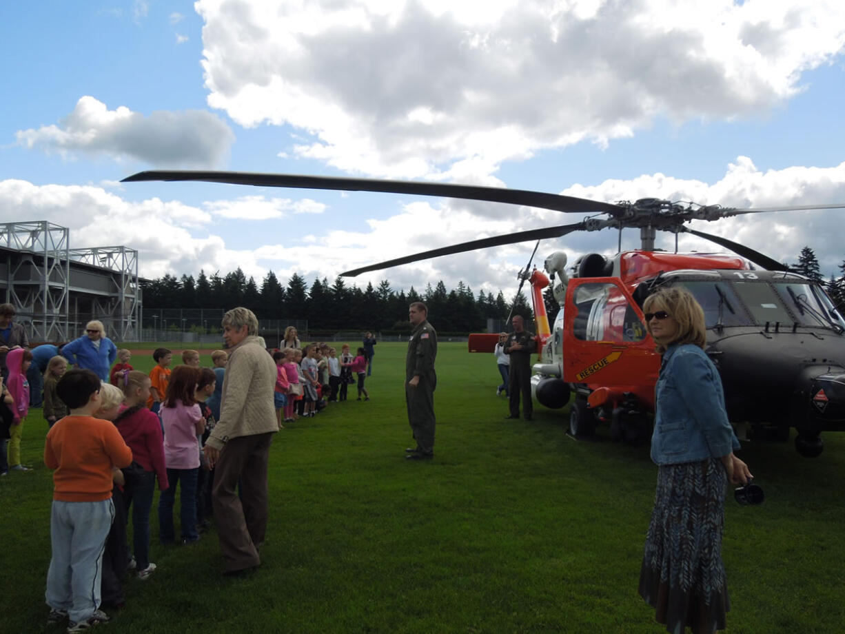 Photos courtesy of Karen Lukowiak
Students from Helen Baller Elementary School (above and below) enjoyed stepping into an MH60-T Jayhawk helicopter and a 25-foot response boat during a recent Coast Guard visit to Doc Harris field. Jeff Lukowiak (not pictured), a resident agent-in-charge with the Coast Guard Investigative Service and a father of two Helen Baller students, arranged the visit.