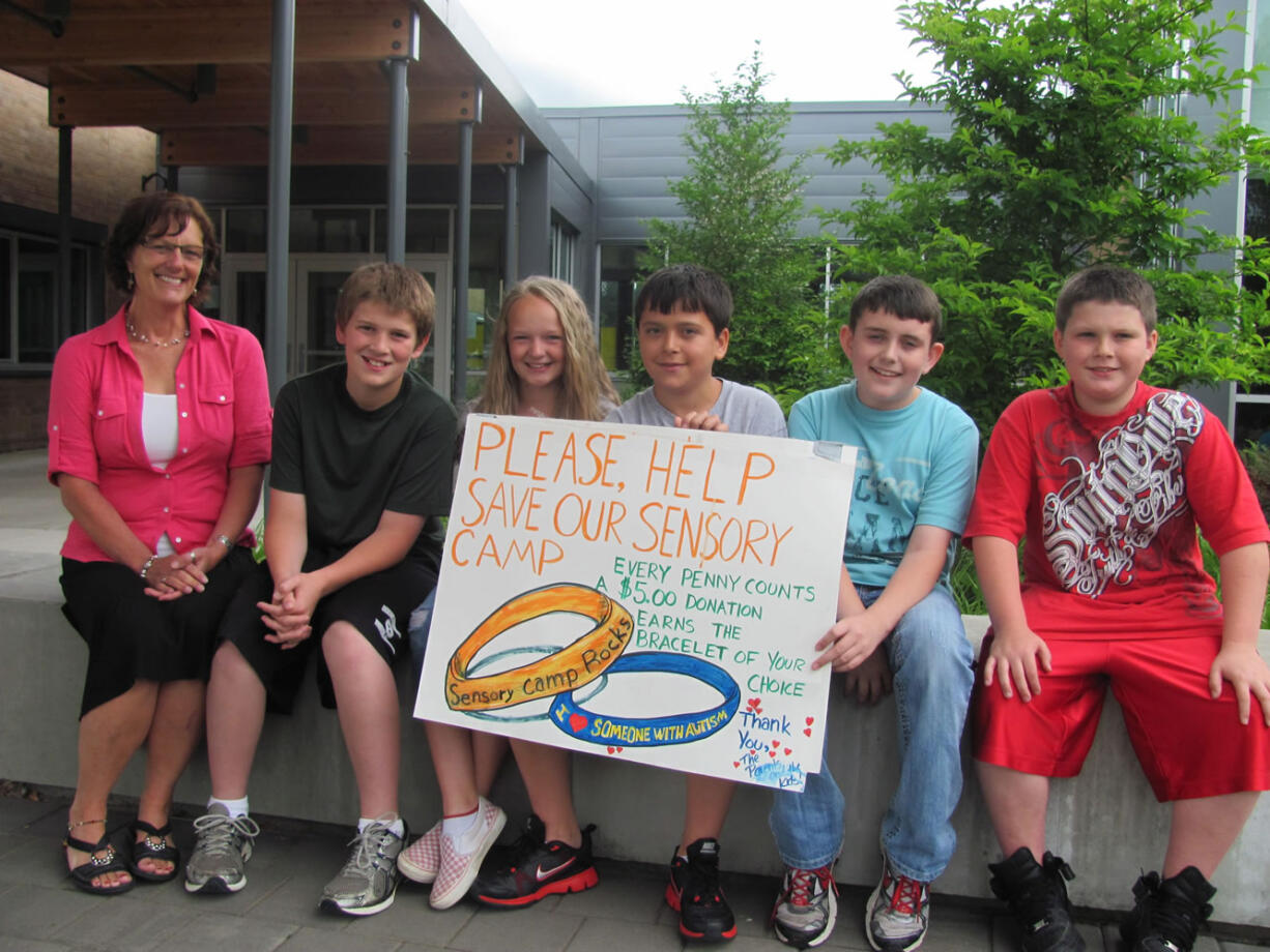 Helen Baller Elementary School teacher Laurie Brown and fifth-graders (from left) Billy Schuldt, Janessa Terry, Edward Kovalenko, Blake Riggs and James delGiudice were instrumental in the effort to raise money to save a special needs sensory camp in Vancouver, attended by school district nurse April Sutherland's son, Liam.