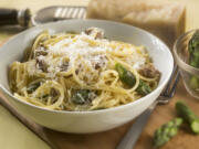 While not fitting the ingredient list for traditional carbonara, this version with Italian sausage and pea shoots makes a quick dinner and uses what is on hand.