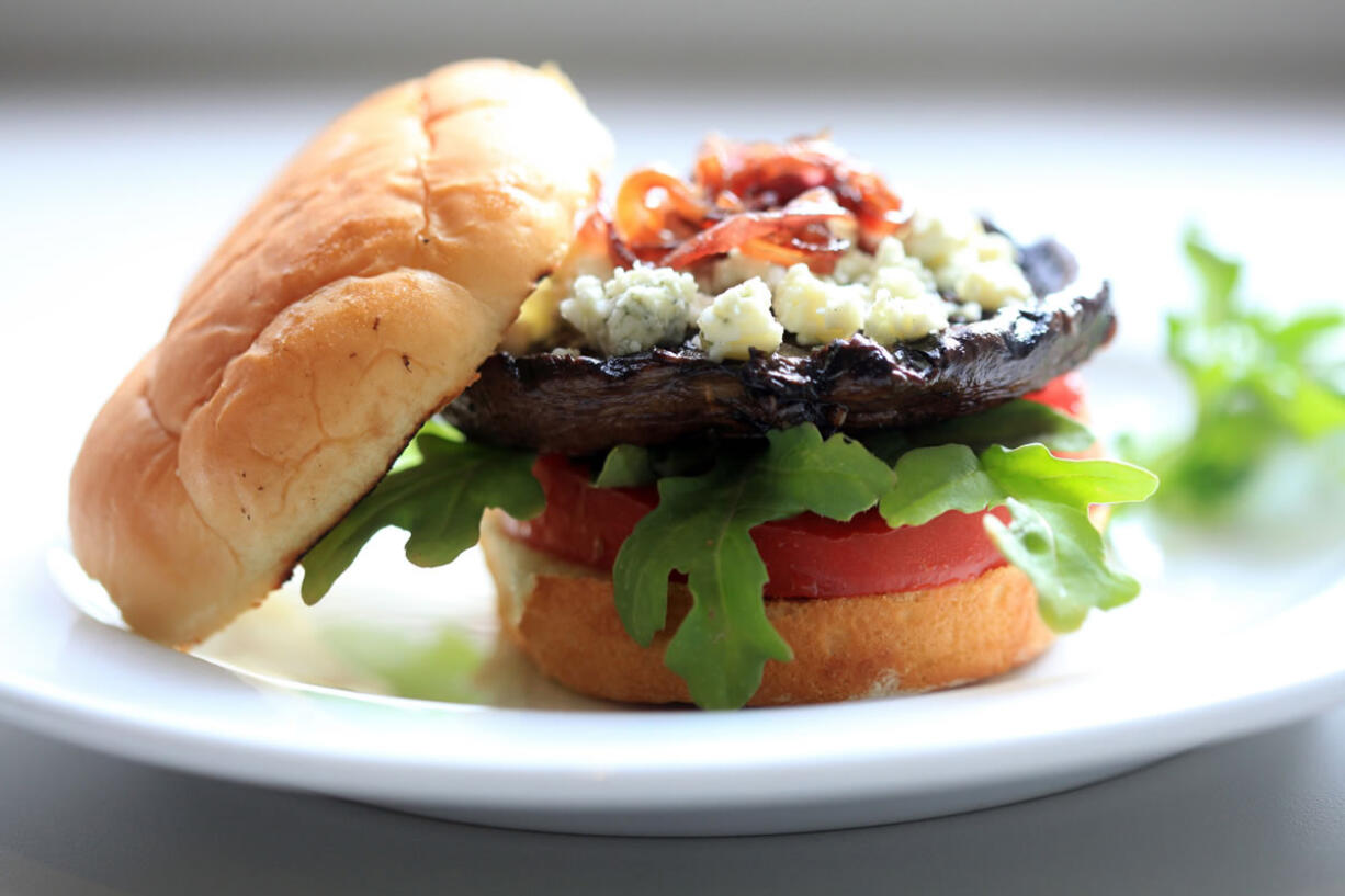 Size, texture and a meaty flavor make portabella mushrooms a good substitute for meat on a burger in this blue cheese version.