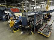 Employees work on the napping machine at the Pendleton Woolen Mills textile mill in Washougal in November.