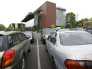 A small parking lot is filled to capacity May 8 at the Vancouver Community Library.