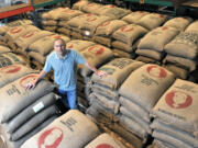 Michael Jones, founder of Thrive Farmers Coffee, stands at a warehouse of Thrive Farmers Coffee in Roswell, Ga., on June 13.