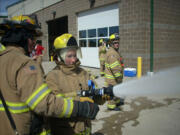 Photos courtesy of ECFR
A ECFR Citizens Academy participant works to extinguish a &quot;live&quot; vehicle fire. The academy gave citizens the opportunity to get an up-close and personal look at a day in the life of a firefighter.