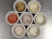 Seven of the homemade ice creams at the Thai Orchid Cafe in Lexington: Pictured are coffee stout, top left, bourbon-honey; middle row from left, organic strawberry sorbet, Kentucky blackberry and vanilla bean; bottom row from left, organic strawberry and coconut.