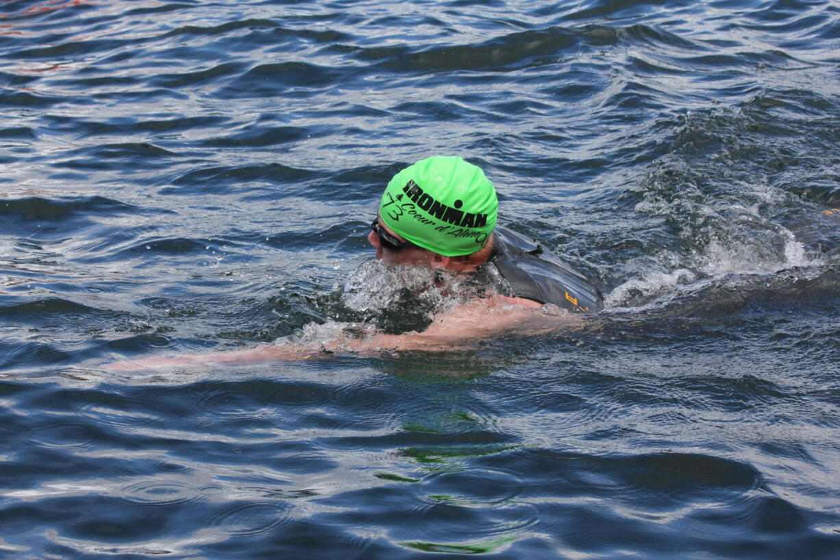 Washougal's Nathan Milojevic swims through Lake Coeur d'Alene to begin the Ironman Coeur d'Alene June 23.