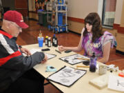 Wendell Heim created Japanese-style calligraphy with Noelle Schmidt, a sophomore at Washougal High School. Heim, a veteran of World War II and the Korean War, recently talked about his personal and military experiences with the Japanese class at WHS. &quot;I enjoyed having him in class discussions,&quot; Schmidt said.