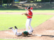 Nate Lauritzen gets down and dirty for the Camas-Washougal Granite against the Vancouver Jayhawks during the semifinals of the Southwest Washington Senior Babe Ruth state tournament Saturday, at Louis Bloch Park in Camas.