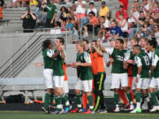 Nicholas Hamer (far left) joins in the celebration after providing the asisst on the decisive goal scored by Mark Sherrod.