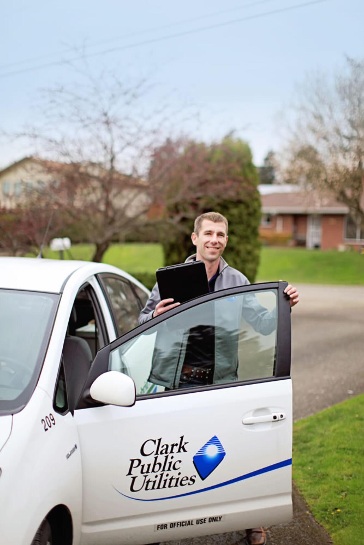 Energy counselor Matt Babbitts arrives at a customer's home for a free in-home energy review in April.