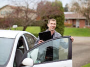 Energy counselor Matt Babbitts arrives at a customer's home for a free in-home energy review in April.