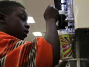 Ray Jenkins, 6, makes a Slurpee at a 7-Eleven in Baltimore, Md.